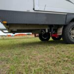 Redfoot flip leg system retracted behind caravan rear wheels