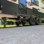 Caravan being jacked up by the AutoLift system