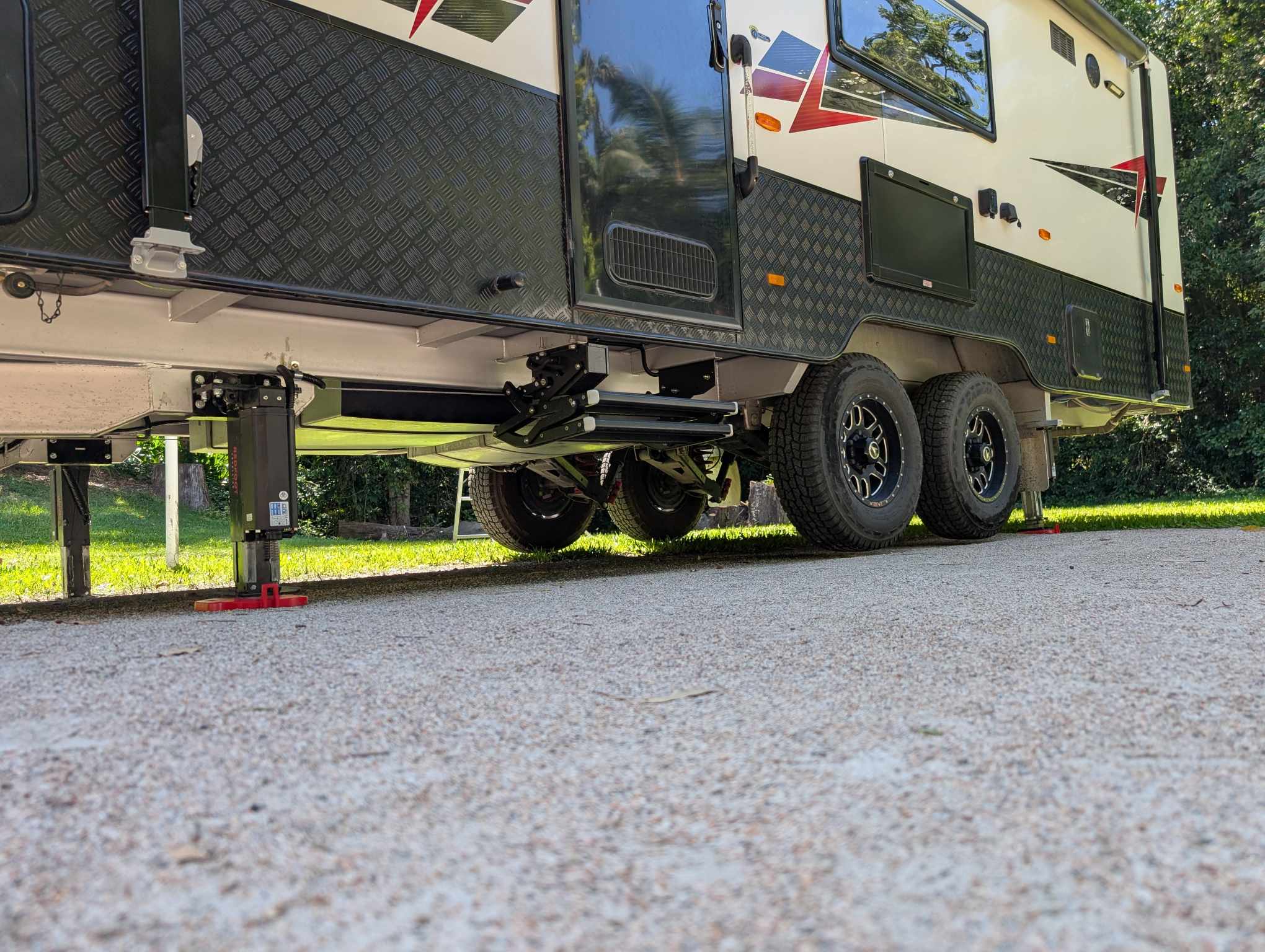 Caravan being jacked up by the AutoLift system