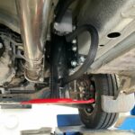 Underside of Ford Transit with hydraulic jack attached