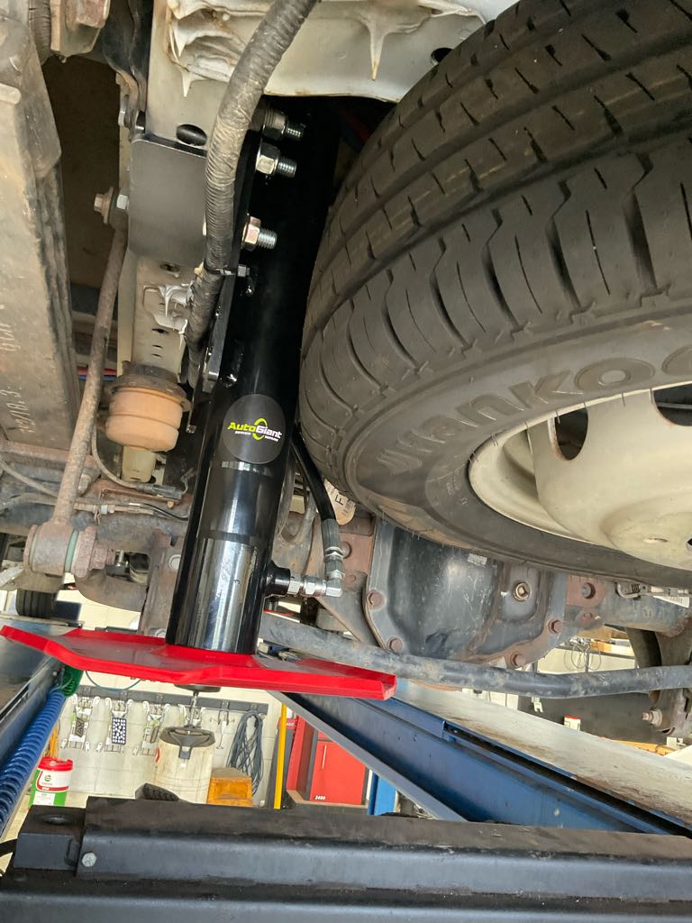 Hydraulic jack attached to chassis of Ford Transit