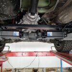 Under-chassis photo of Redfoot jacks attached